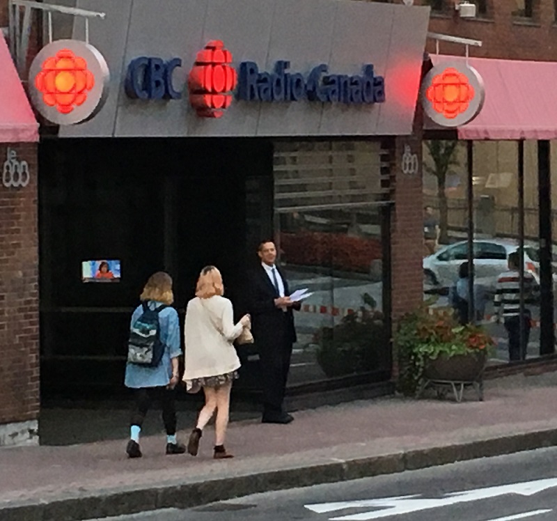 Stefan handing out Elliott-Approved flyer front of the CBC building on St. John Street, Quebec City.