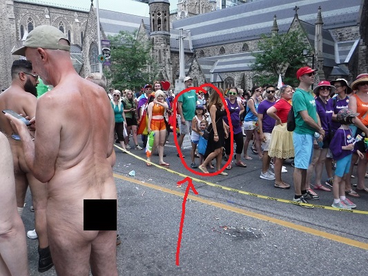 Two small children being exposed to the disordered sexuality on display at the 2016 Toronto Gay Pride parade.