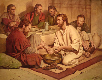 Jsus lavant les pieds humblement.