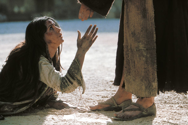 Jesus forgiving the adulteress.